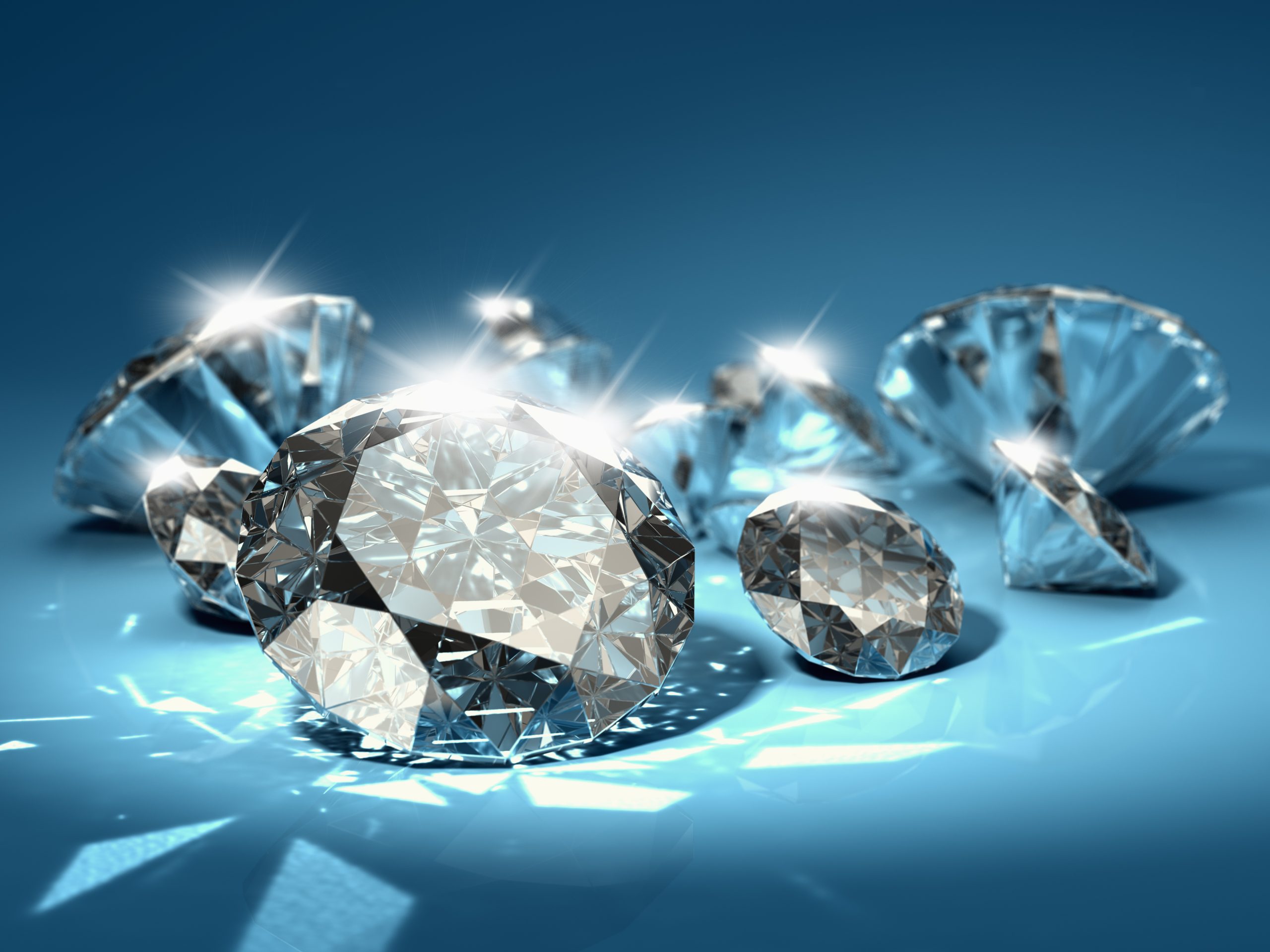 Brilliant,Diamonds,On,Blue,Background